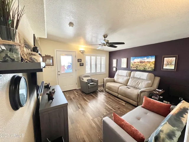 a living room with furniture and windows