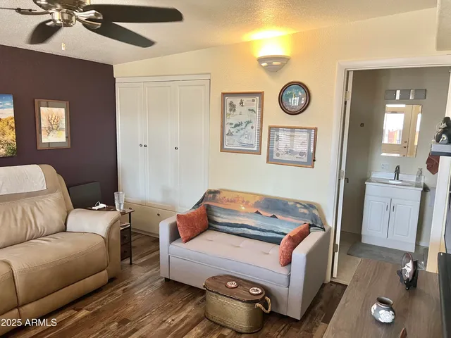 a living room with a fireplace and a flat screen tv