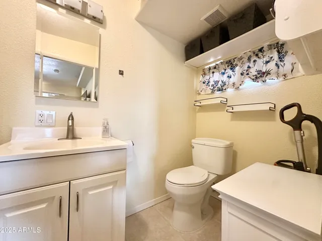 a view of a livingroom with furniture window and wooden floor