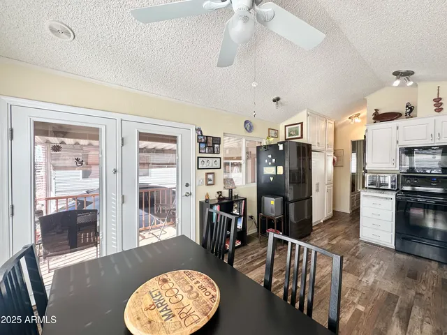 a kitchen with stainless steel appliances and white cabinets