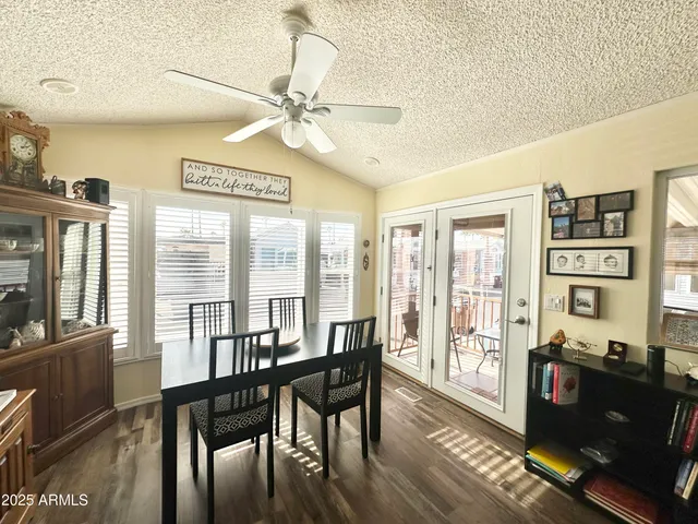 a kitchen with stainless steel appliances kitchen island granite countertop a stove and a sink