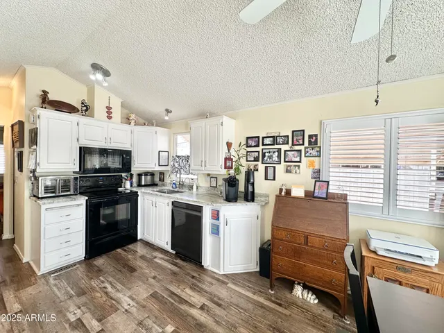 a view of a bathroom with a tub shower and sink