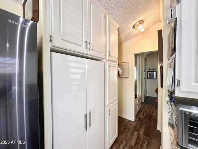 a bathroom with a toilet a sink and a mirror