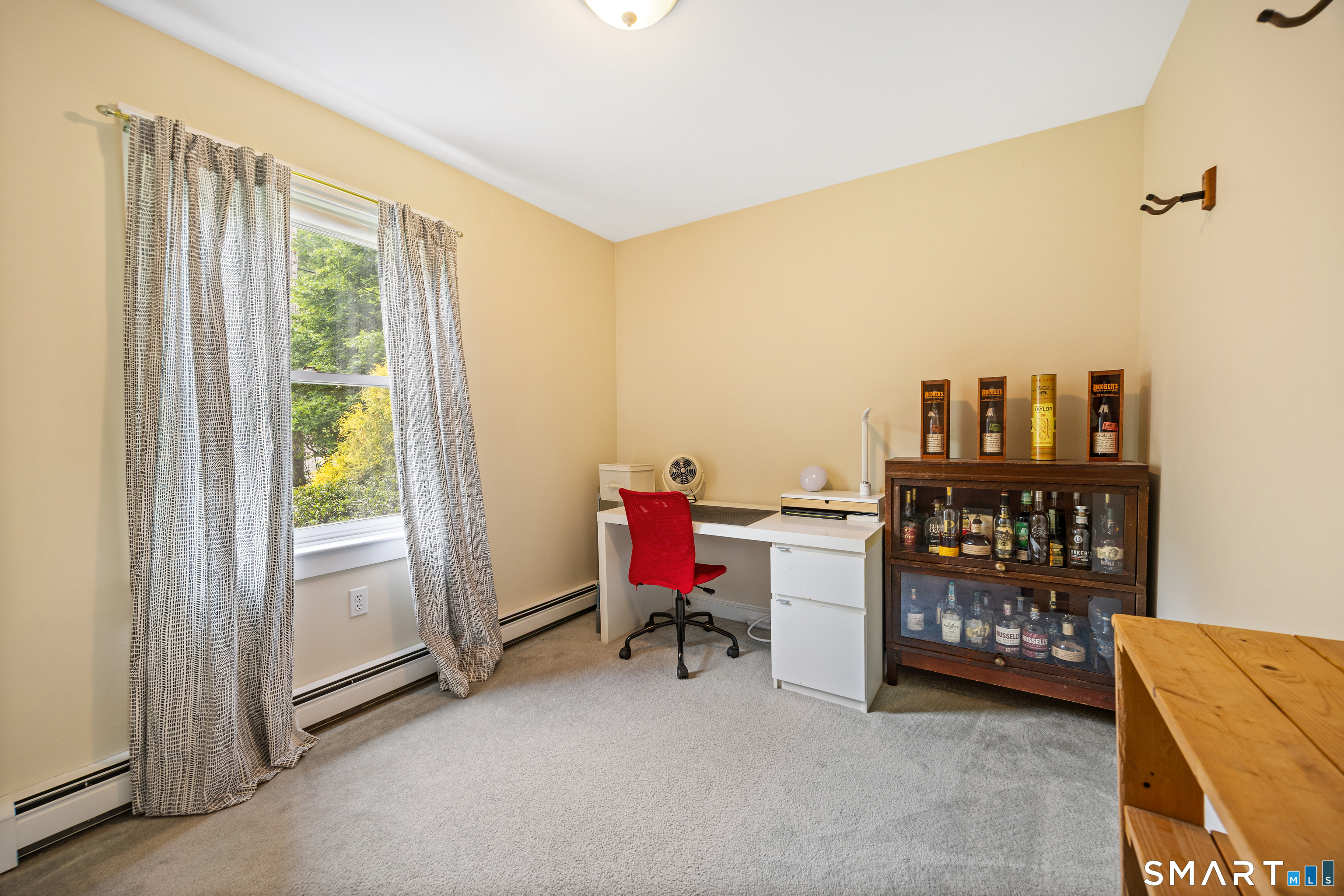 694 Millbrook Road Middletown, CT 06457 - Photo 12 of 34 a view of a workspace with furniture and a window