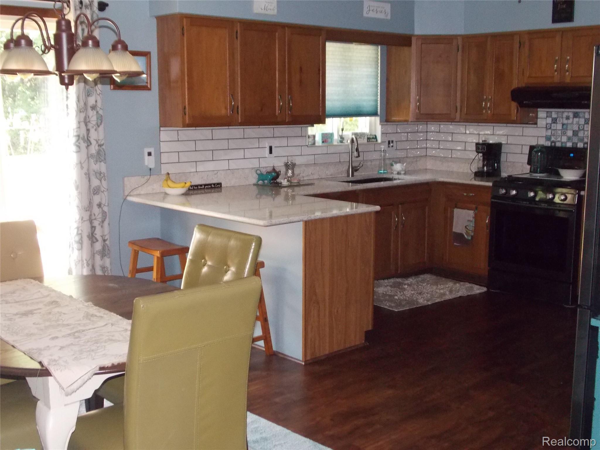 2371 King Road Lapeer, MI 48446 - Photo 7 of 23 The open kitchen/dining area will be the hub of activity after the kids get home from school.
