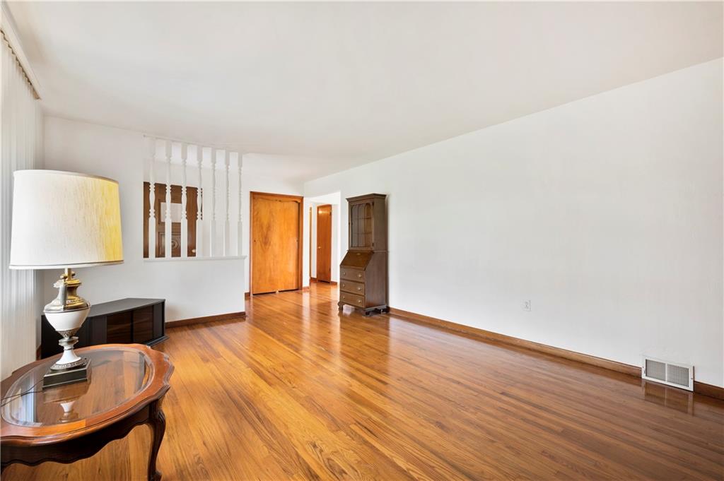 5535 Glass Road Pittsburgh, PA 15205 - Photo 5 of 23 The living room is spacious enough for plenty of furniture.