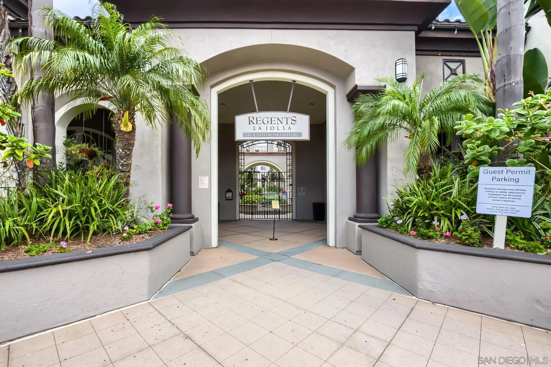 9293 Regents Road, Unit C108 La Jolla, CA 92037 - Photo 2 of 14 a front view of a house with garden