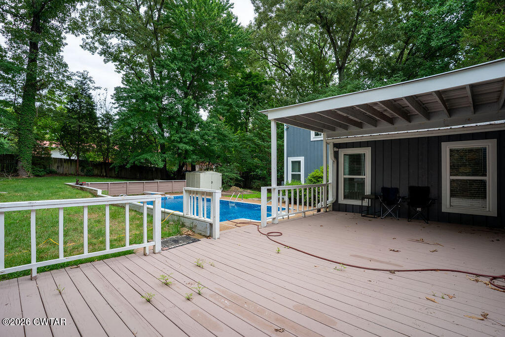 7 Timberlake Drive Jackson, TN 38305 - Photo 33 of 38 a view of a house with a wooden floor and a yard