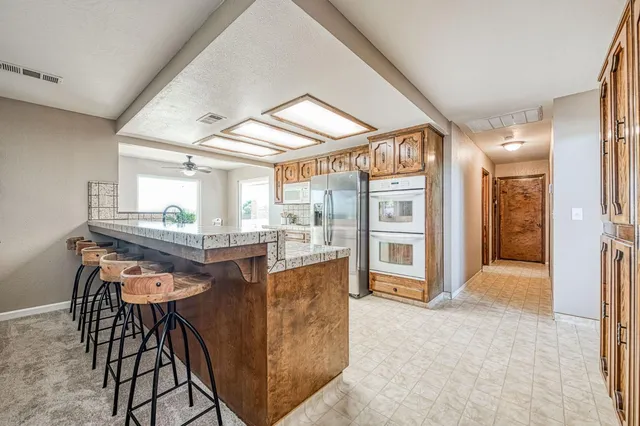 a view of a kitchen cabinets and dining area