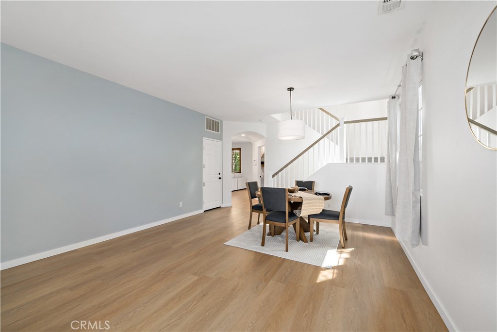 33307 Decada Street Temecula, CA 92592 - Photo 16 of 35 a view of a dining room with furniture and wooden floor