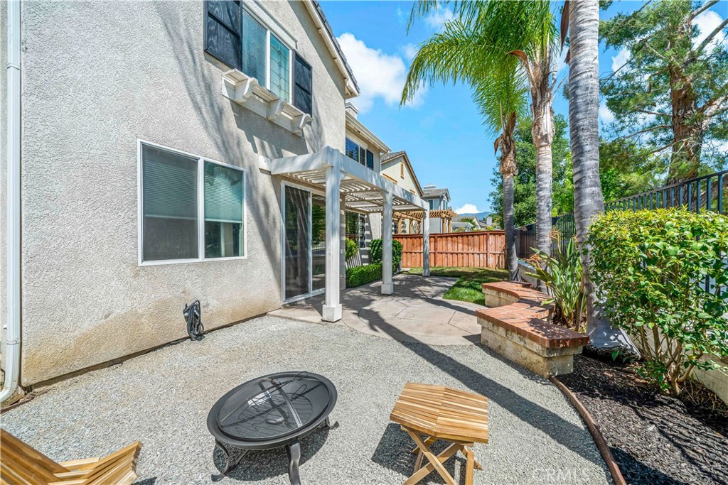 33307 Decada Street Temecula, CA 92592 - Photo 23 of 35 a front view of a house with garden