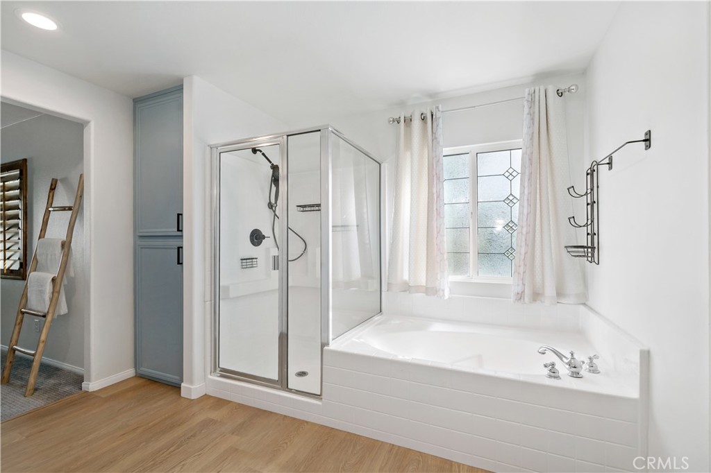 33307 Decada Street Temecula, CA 92592 - Photo 28 of 35 a spacious bathroom with a shower tub and shower