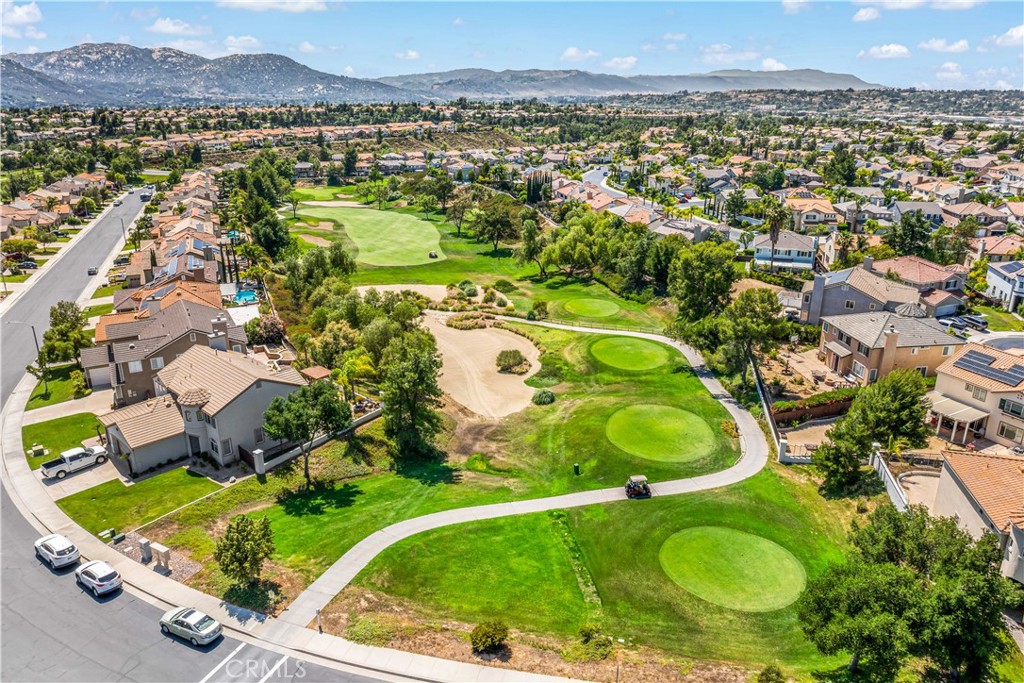 33307 Decada Street Temecula, CA 92592 - Photo 33 of 35 an aerial view of residential houses with outdoor space and a lake view