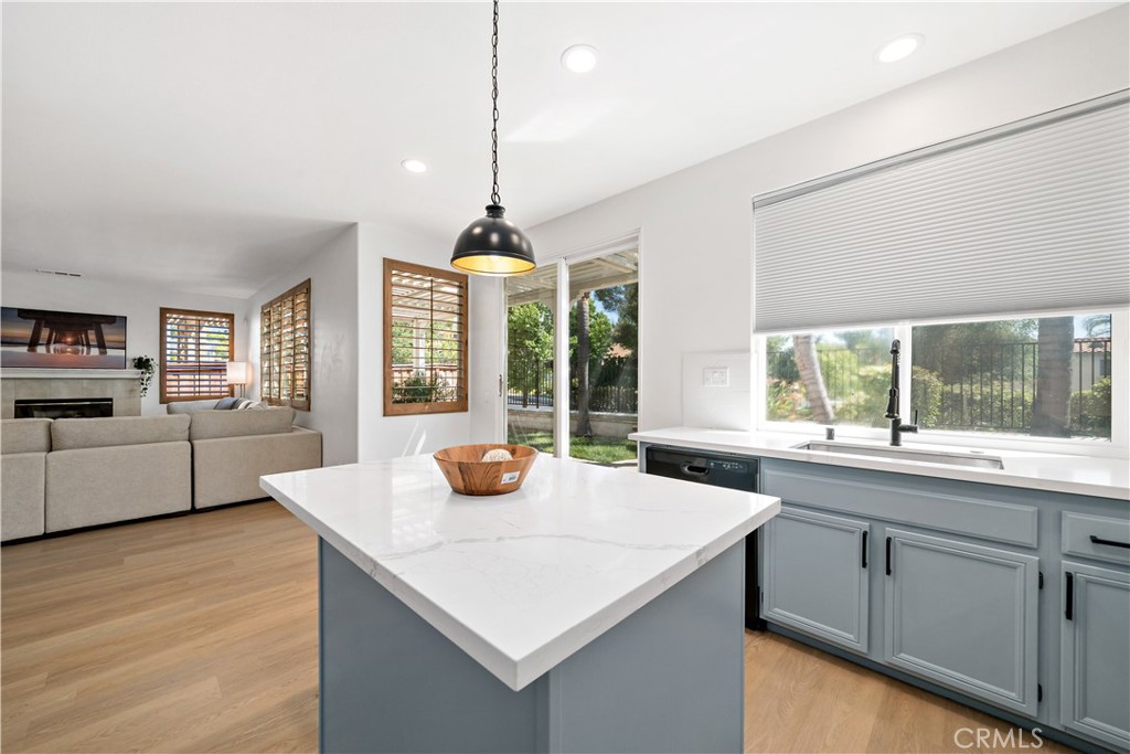 33307 Decada Street Temecula, CA 92592 - Photo 7 of 35 a kitchen with a sink a counter and windows