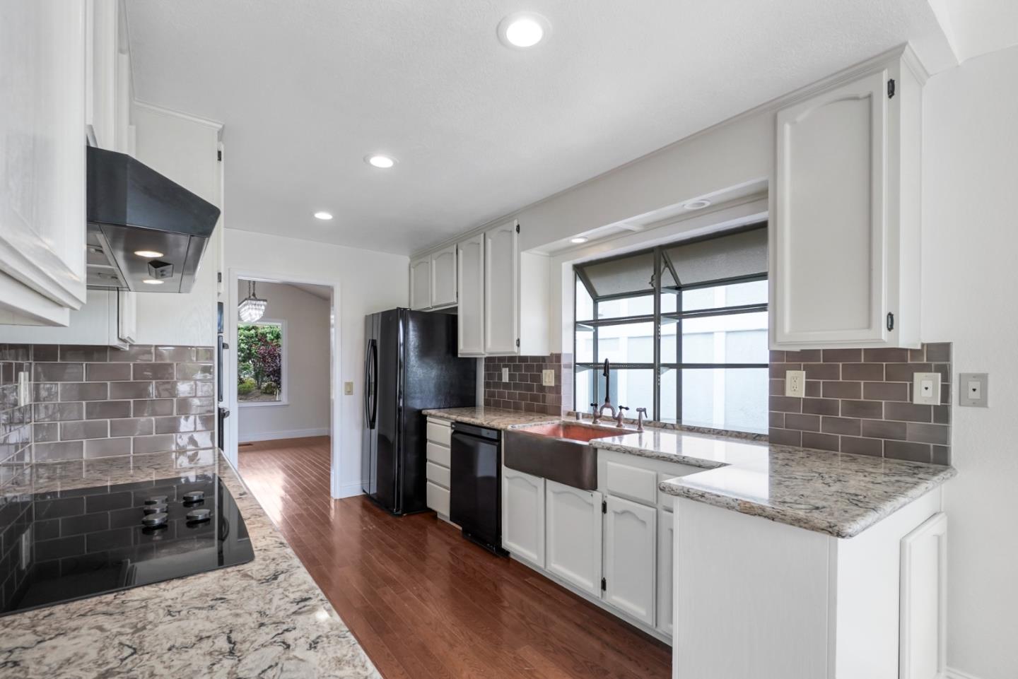190 Cypress Point Road Half Moon Bay, CA 94019 - Photo 12 of 55 a kitchen with stainless steel appliances granite countertop a sink stove and refrigerator