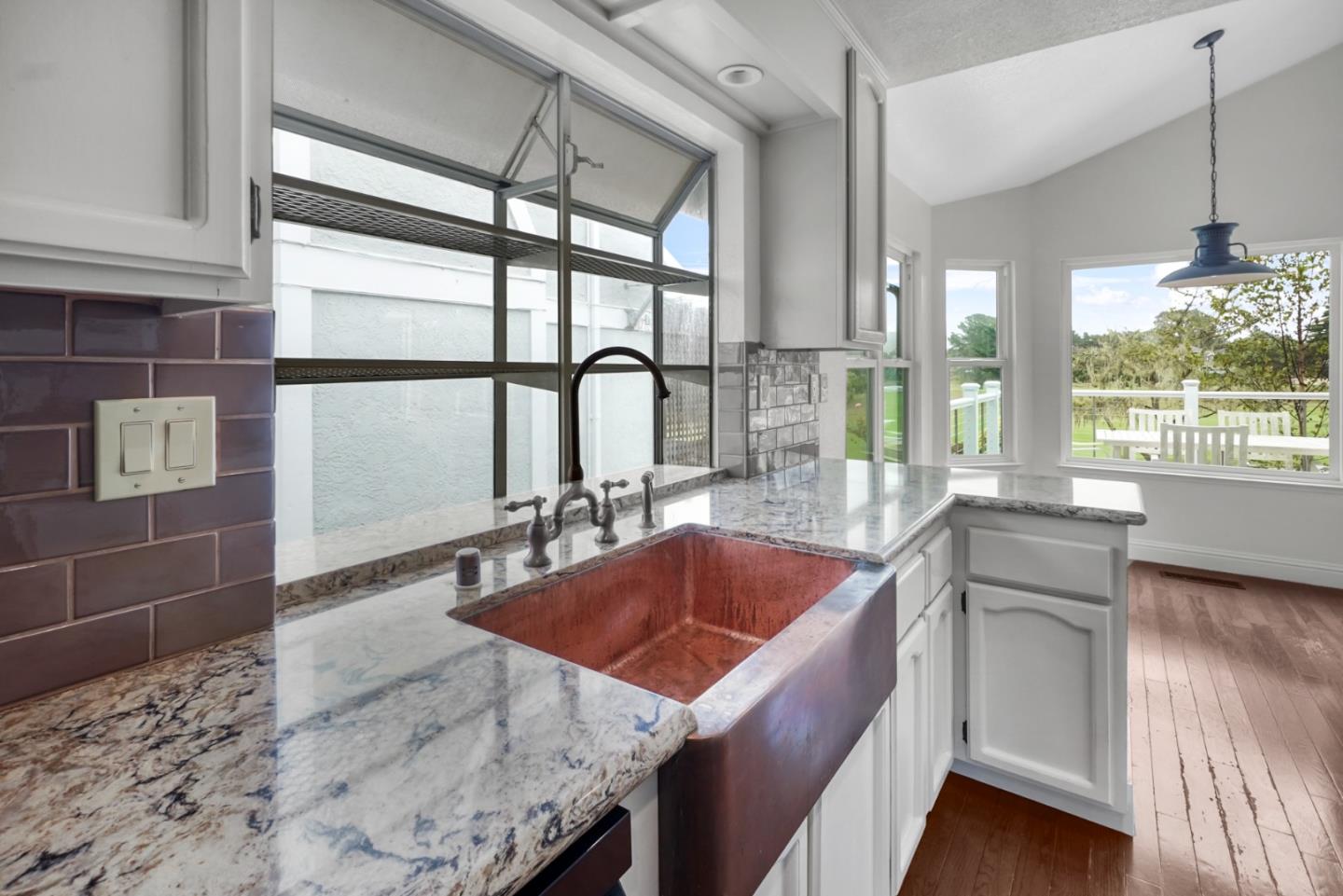 190 Cypress Point Road Half Moon Bay, CA 94019 - Photo 14 of 55 a kitchen with granite countertop a sink and a stove