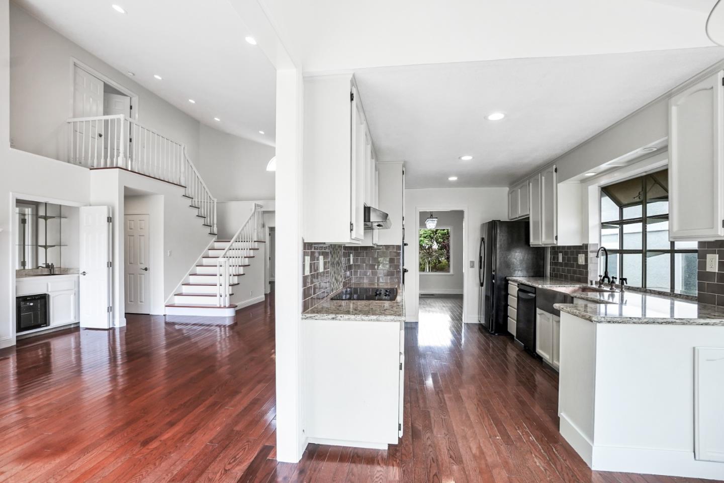 190 Cypress Point Road Half Moon Bay, CA 94019 - Photo 17 of 55 a view of a kitchen with kitchen island wooden floors and stainless steel appliances