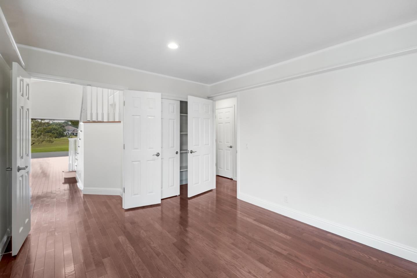 190 Cypress Point Road Half Moon Bay, CA 94019 - Photo 23 of 55 a big room with wooden floor and windows
