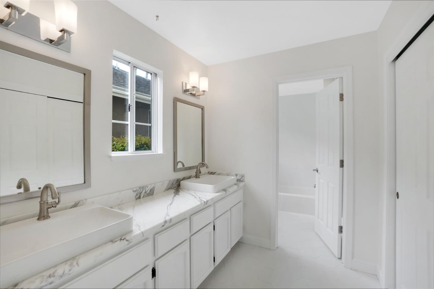 190 Cypress Point Road Half Moon Bay, CA 94019 - Photo 29 of 55 a bathroom with double sink and a mirror