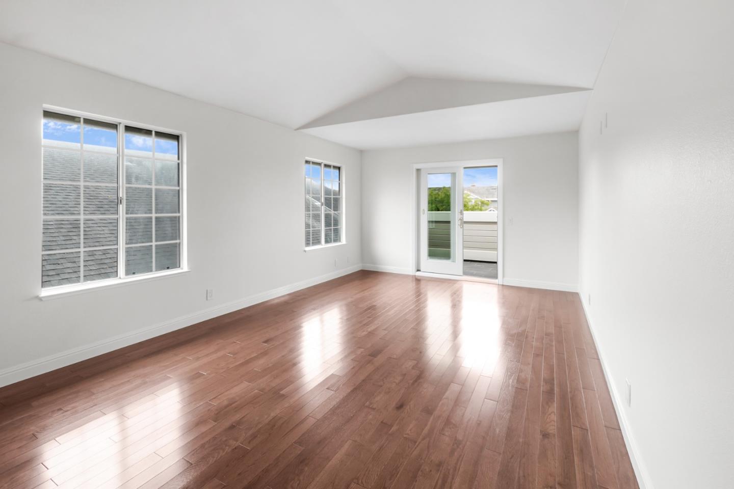 190 Cypress Point Road Half Moon Bay, CA 94019 - Photo 36 of 55 a view of an empty room with wooden floor and a window