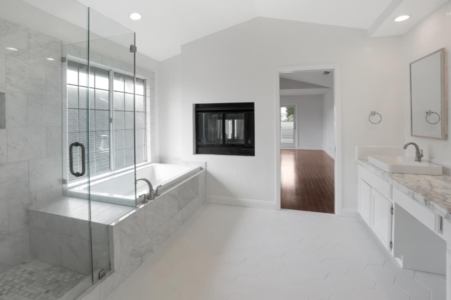 190 Cypress Point Road Half Moon Bay, CA 94019 - Photo 46 of 55 a spacious bathroom with a tub sink and mirror