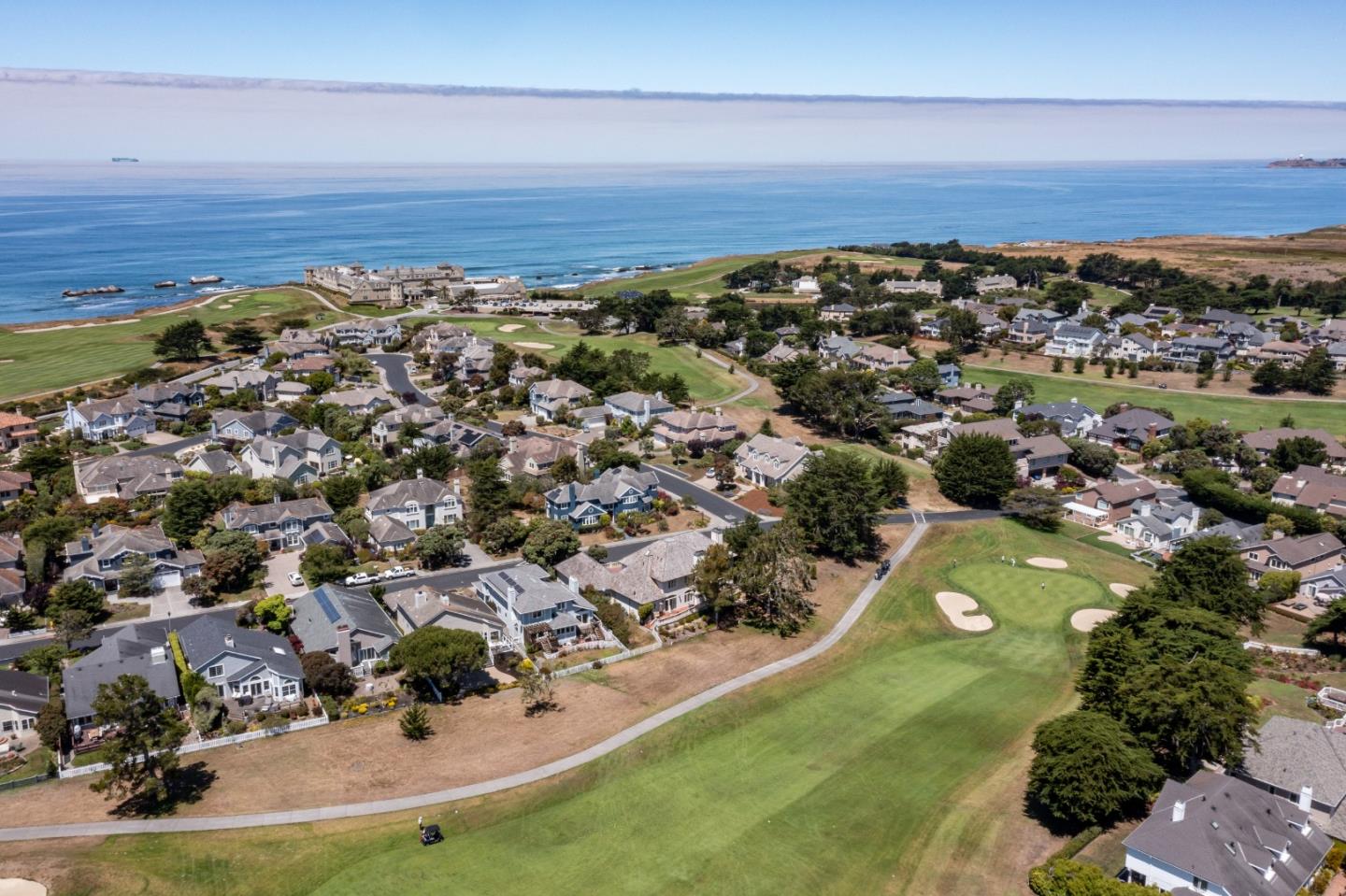 190 Cypress Point Road Half Moon Bay, CA 94019 - Photo 54 of 55 an aerial view of residential houses with outdoor space and ocean view