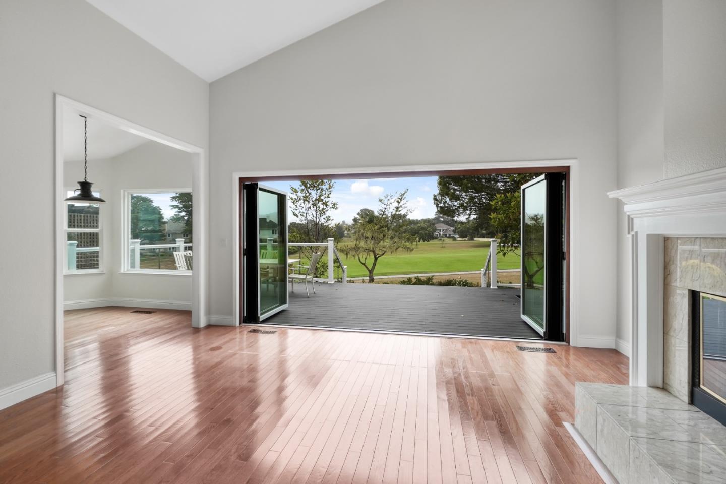 190 Cypress Point Road Half Moon Bay, CA 94019 - Photo 6 of 55 a view of porch with a floor to ceiling window and wooden floor