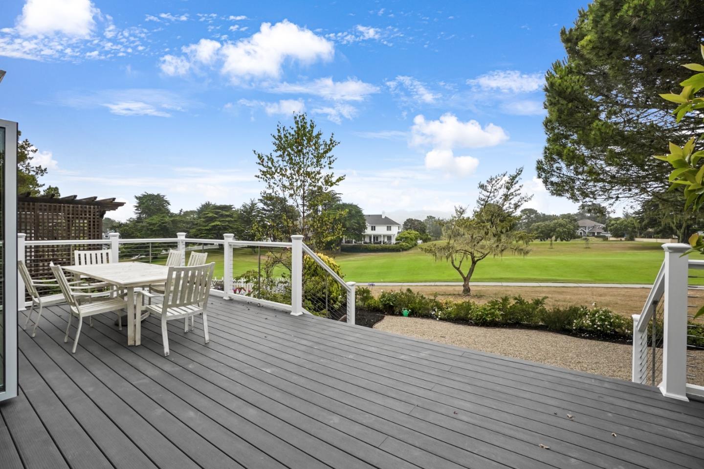 190 Cypress Point Road Half Moon Bay, CA 94019 - Photo 7 of 55 a view of a chairs and table on the wooden roof