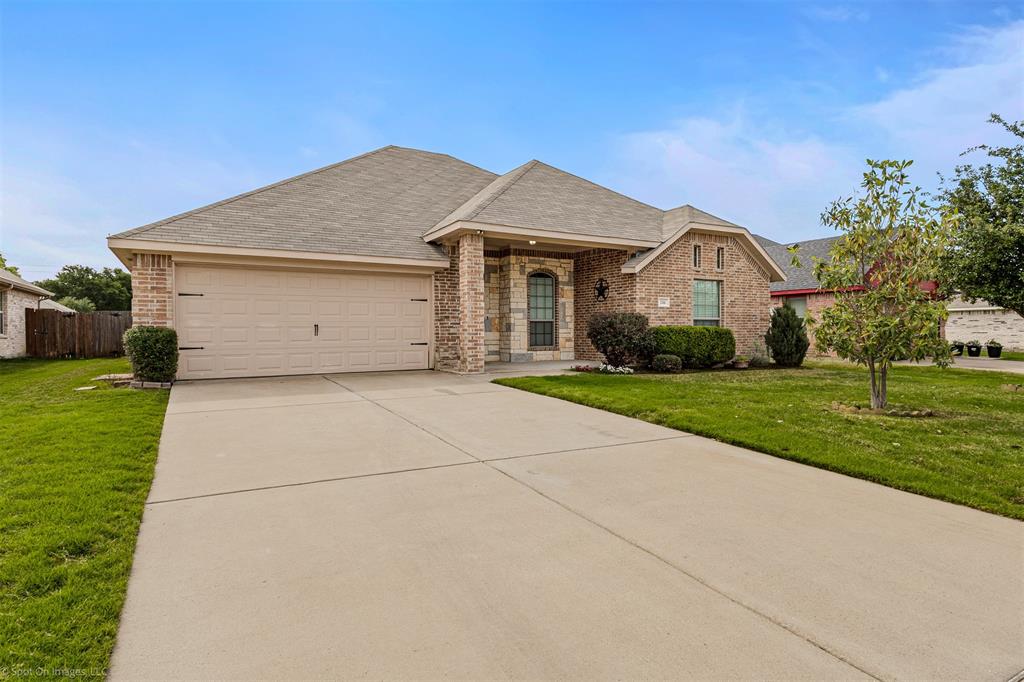 144 Birdsong Lane Terrell, TX 75160 - Photo 1 of 28 a front view of house with yard and green space
