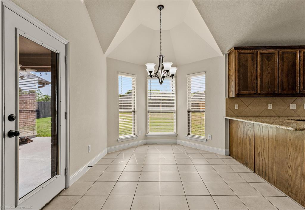 144 Birdsong Lane Terrell, TX 75160 - Photo 12 of 28 a view of an entryway with a chandelier