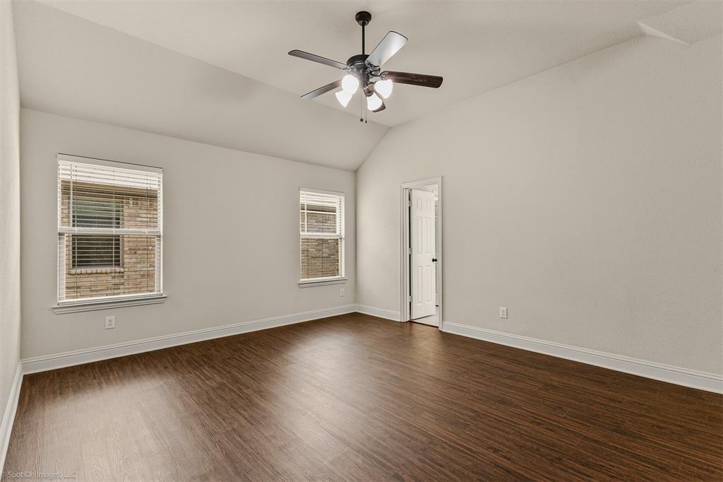 144 Birdsong Lane Terrell, TX 75160 - Photo 13 of 28 a view of an empty room with wooden floor and a window