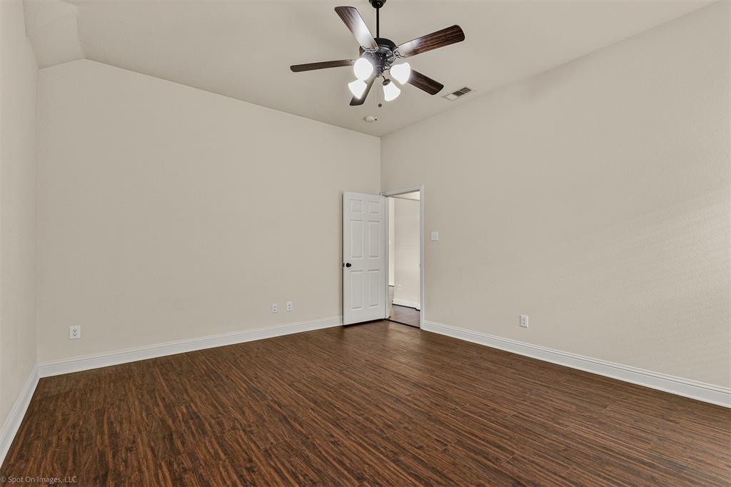 144 Birdsong Lane Terrell, TX 75160 - Photo 14 of 28 a view of an empty room with wooden floor
