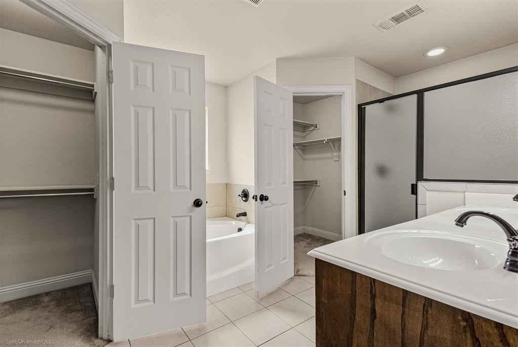 144 Birdsong Lane Terrell, TX 75160 - Photo 15 of 28 a bathroom with a sink and a mirror