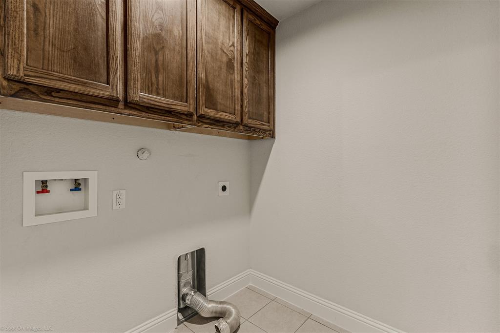 144 Birdsong Lane Terrell, TX 75160 - Photo 24 of 28 a bathroom with a sink and cabinets