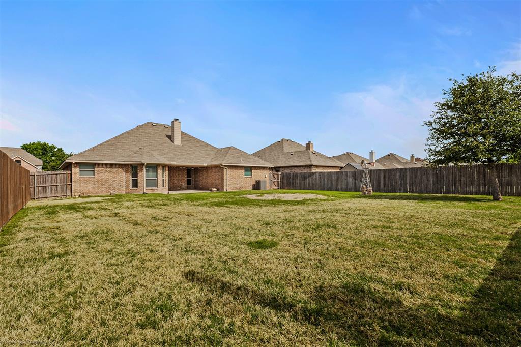 144 Birdsong Lane Terrell, TX 75160 - Photo 28 of 28 a front view of a house with garden