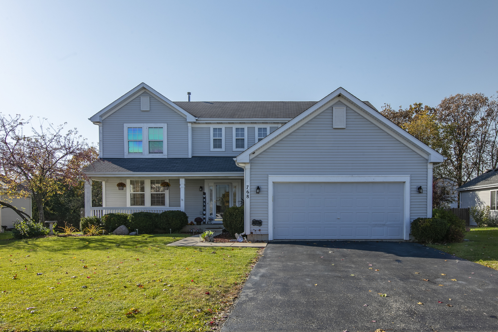 768 North Overlook Trail Round Lake, IL 60073 - Photo 2 of 34 a front view of a house with garden