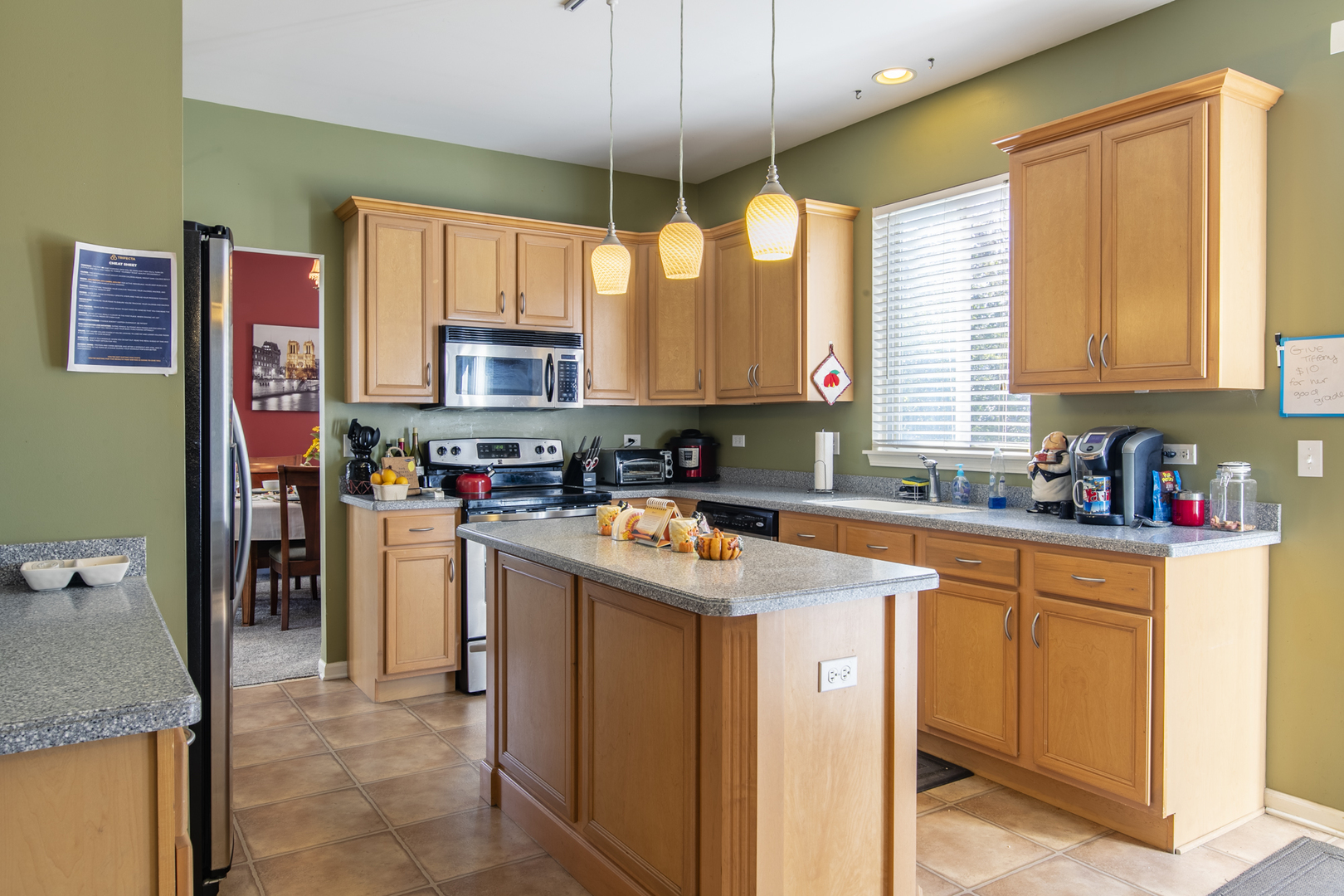 768 North Overlook Trail Round Lake, IL 60073 - Photo 14 of 34 a kitchen with stainless steel appliances granite countertop a stove a sink and a refrigerator
