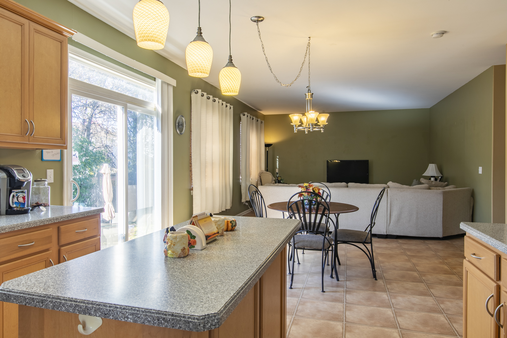 768 North Overlook Trail Round Lake, IL 60073 - Photo 16 of 34 a kitchen with a table chairs and a dining table