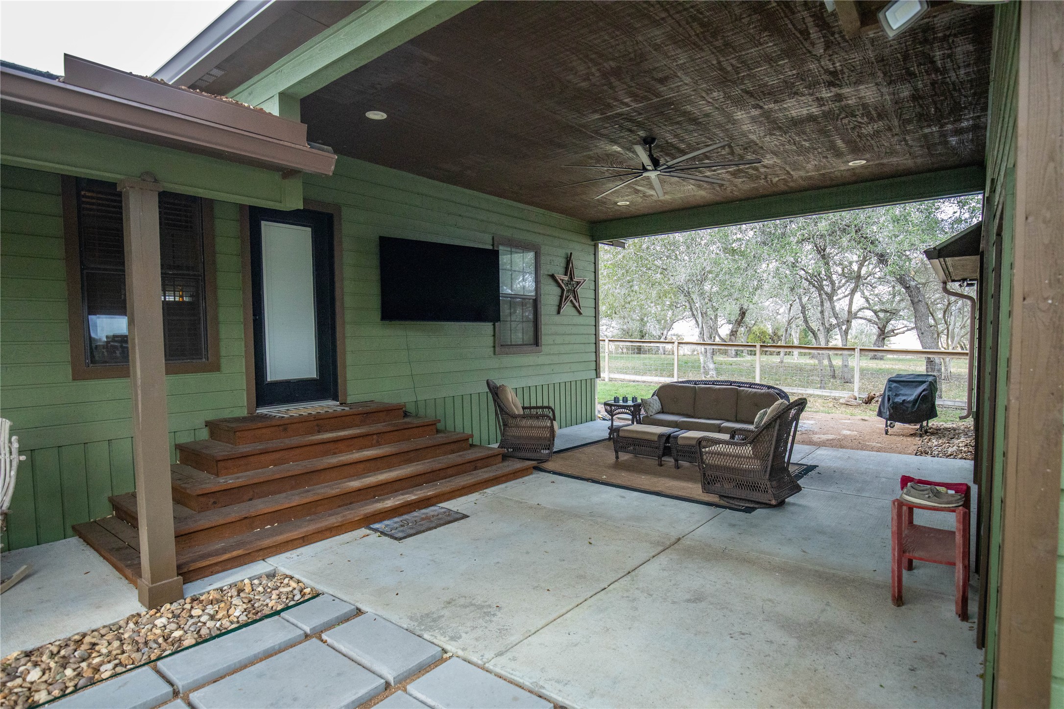 698 Hilbrich Road Westhoff, TX 77994 - Photo 24 of 40 a outdoor living space with furniture and a flat screen tv