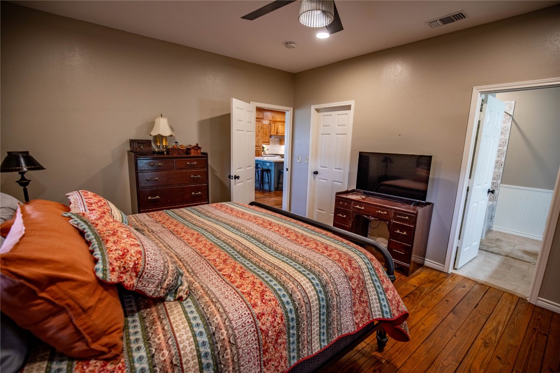698 Hilbrich Road Westhoff, TX 77994 - Photo 27 of 40 a bedroom with a bed and a flat screen tv