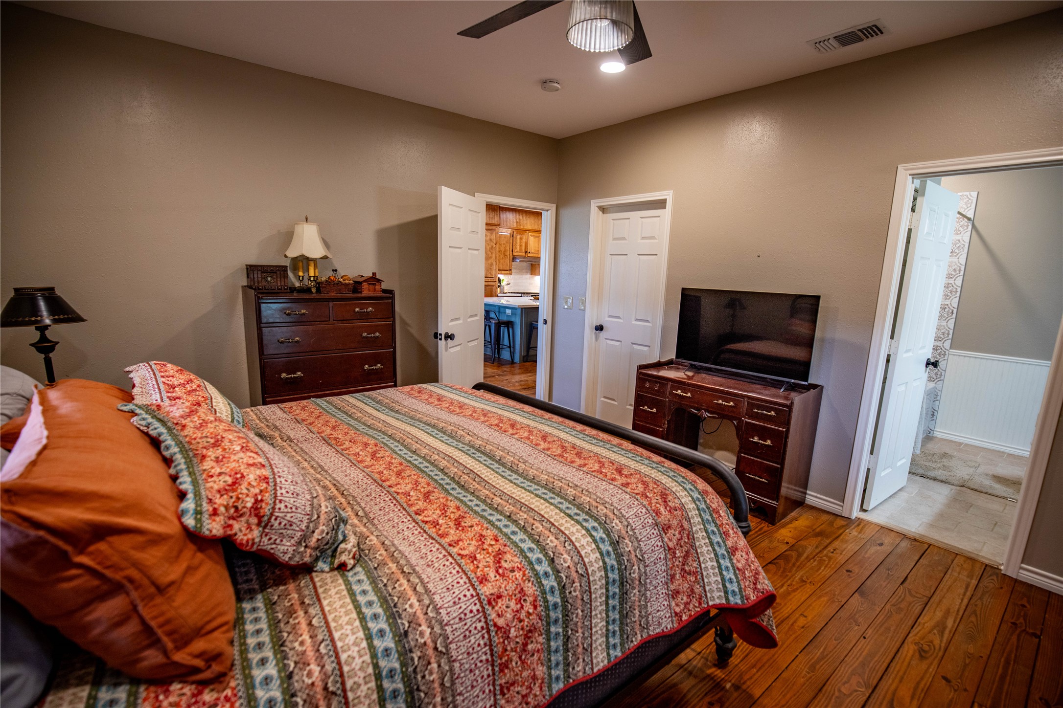698 Hilbrich Road Westhoff, TX 77994 - Photo 27 of 40 a bedroom with a bed and a flat screen tv