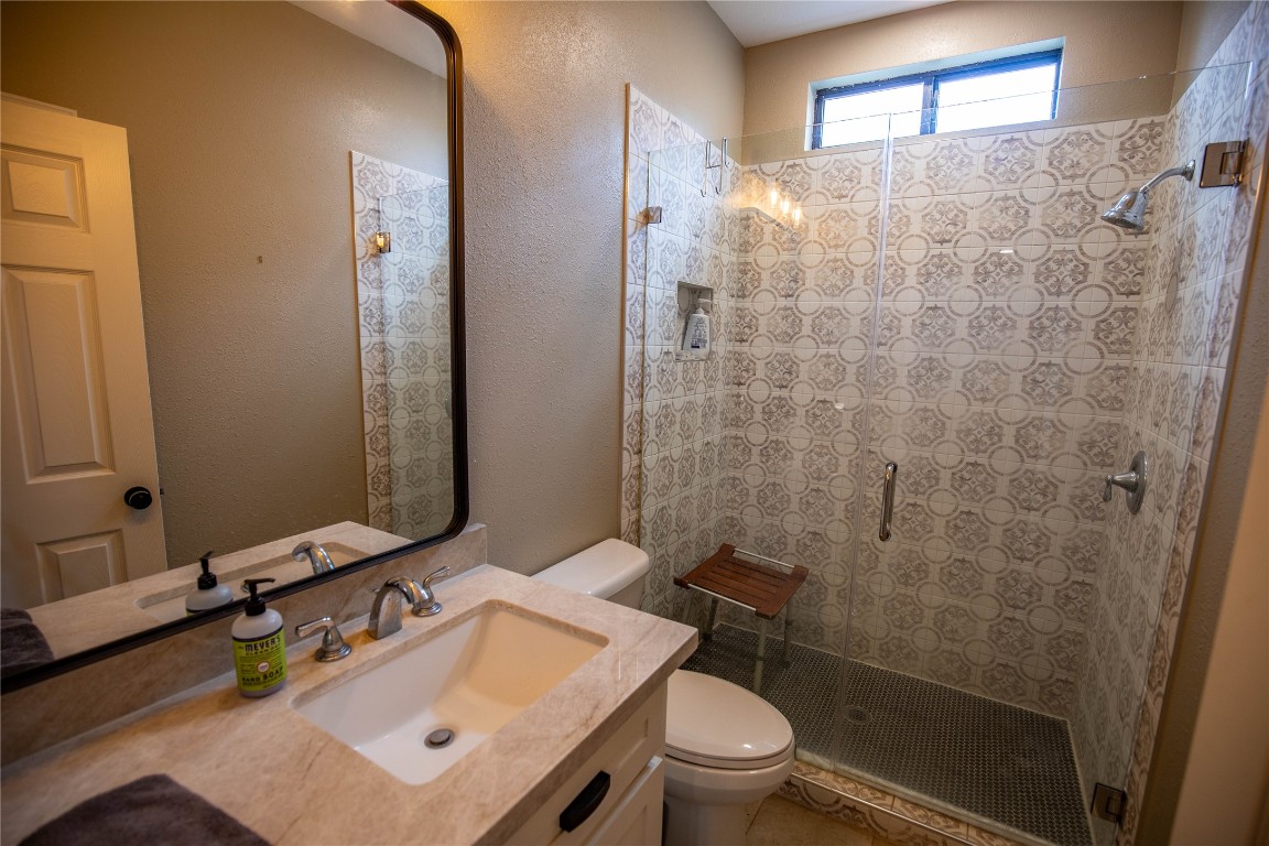 698 Hilbrich Road Westhoff, TX 77994 - Photo 28 of 40 a bathroom with a sink toilet and shower