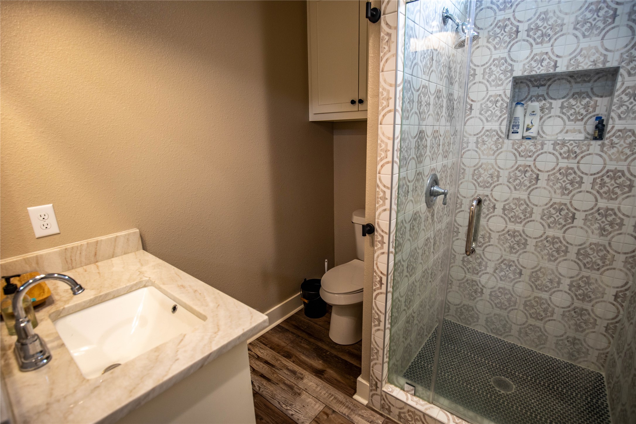 698 Hilbrich Road Westhoff, TX 77994 - Photo 30 of 40 a bathroom with a granite countertop shower and a toilet