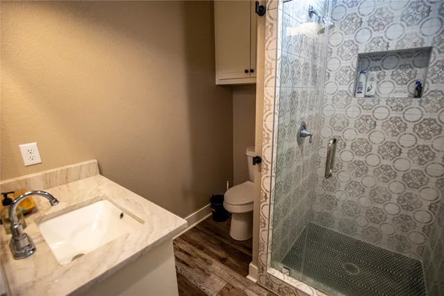 a spacious bedroom with a bed and a couch