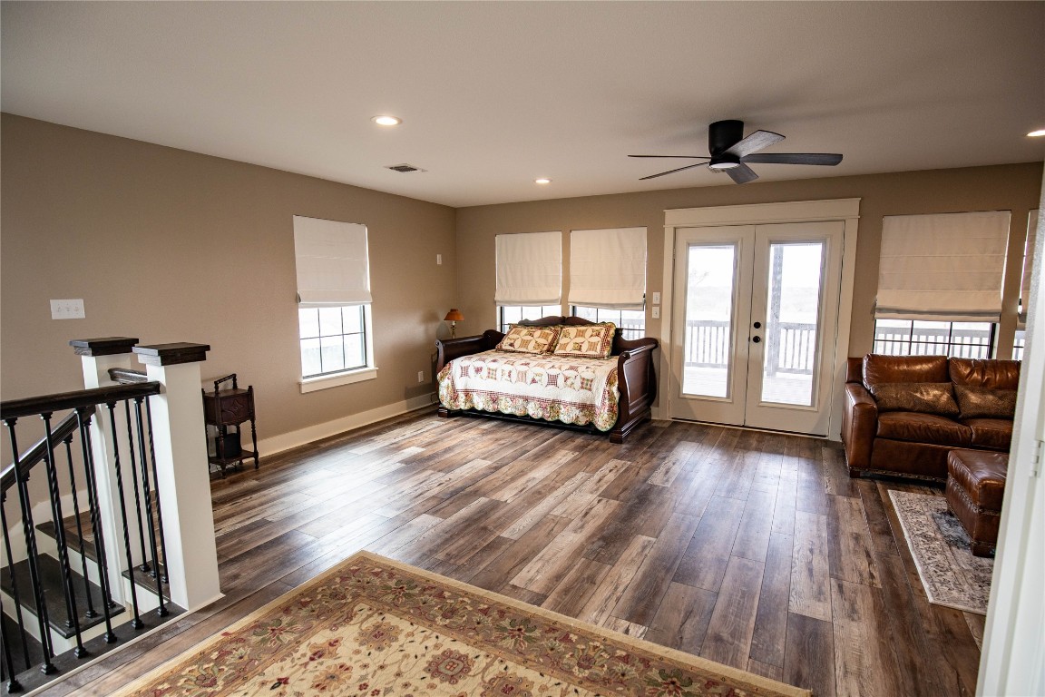 698 Hilbrich Road Westhoff, TX 77994 - Photo 31 of 40 a spacious bedroom with a bed and a couch