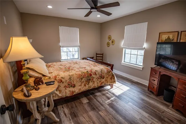 a living room with a bed furniture and a window