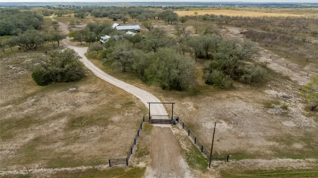 a aerial view of a house with big yard