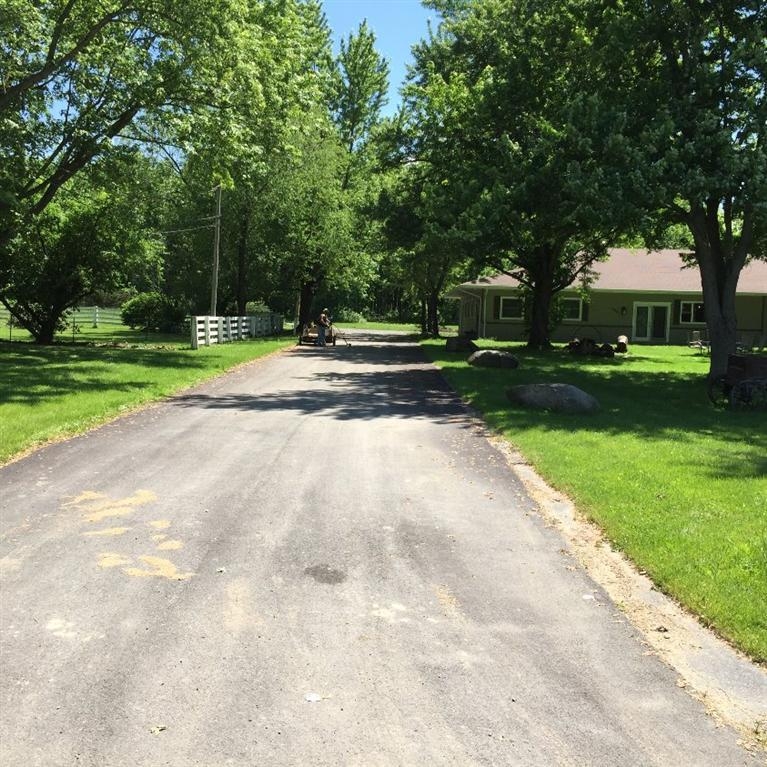 446 West Division Road Valparaiso, IN 46385 - Photo 6 of 10 a view of a house with a big yard and large trees