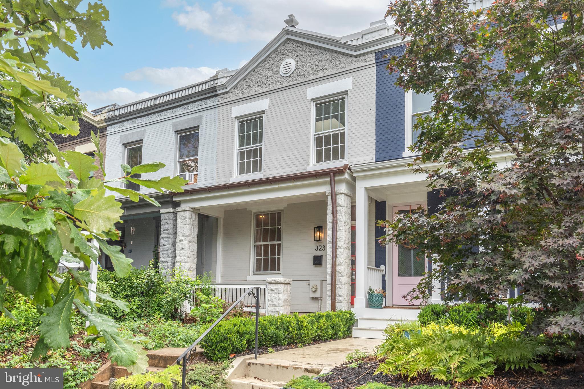 a front view of a house with garden