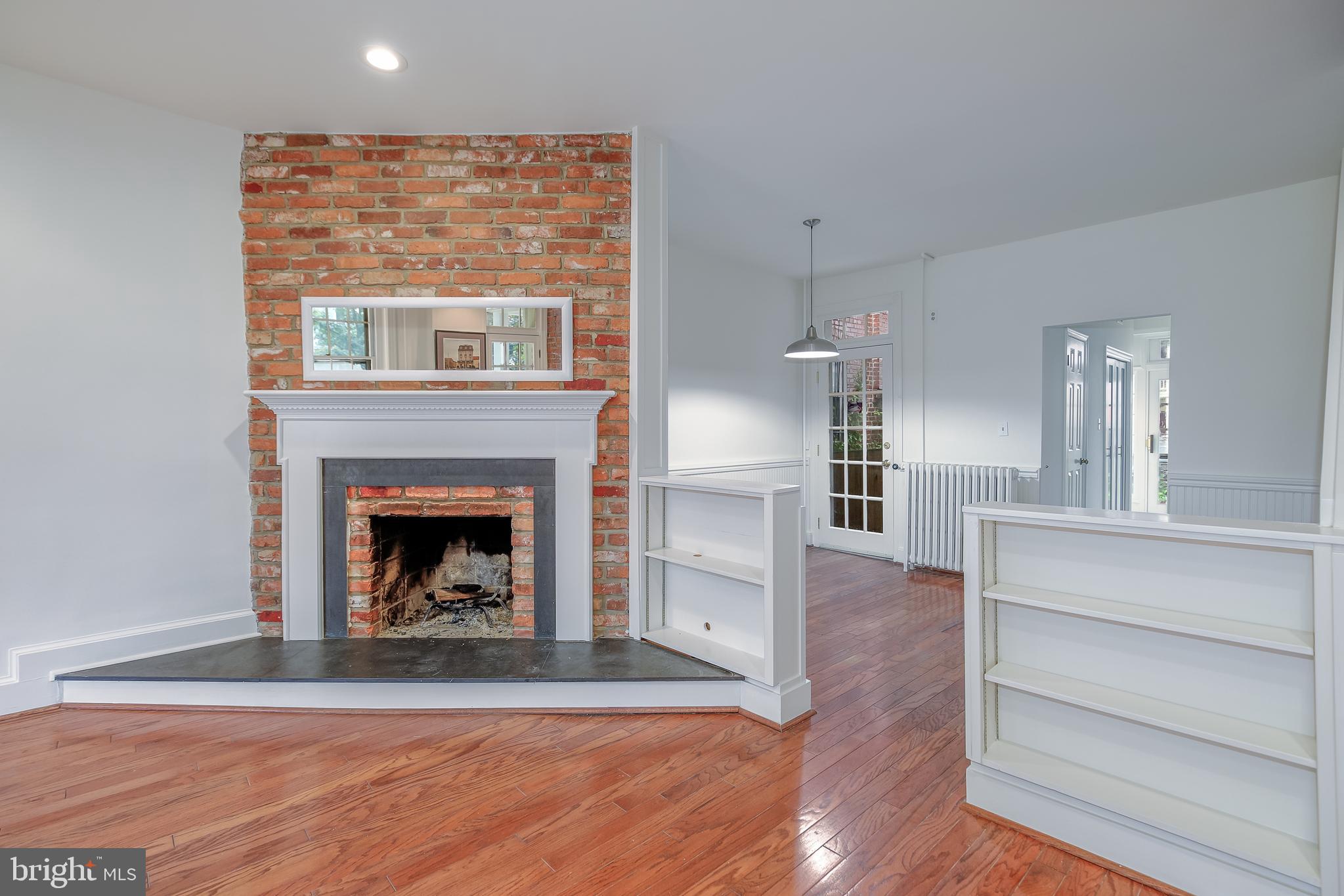 323 14th Street Northeast Washington, DC 20002 - Photo 13 of 41 a living room with wooden floor and a fireplace
